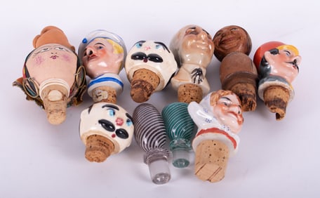A Collection of Vintage Figural Liquor Stoppers