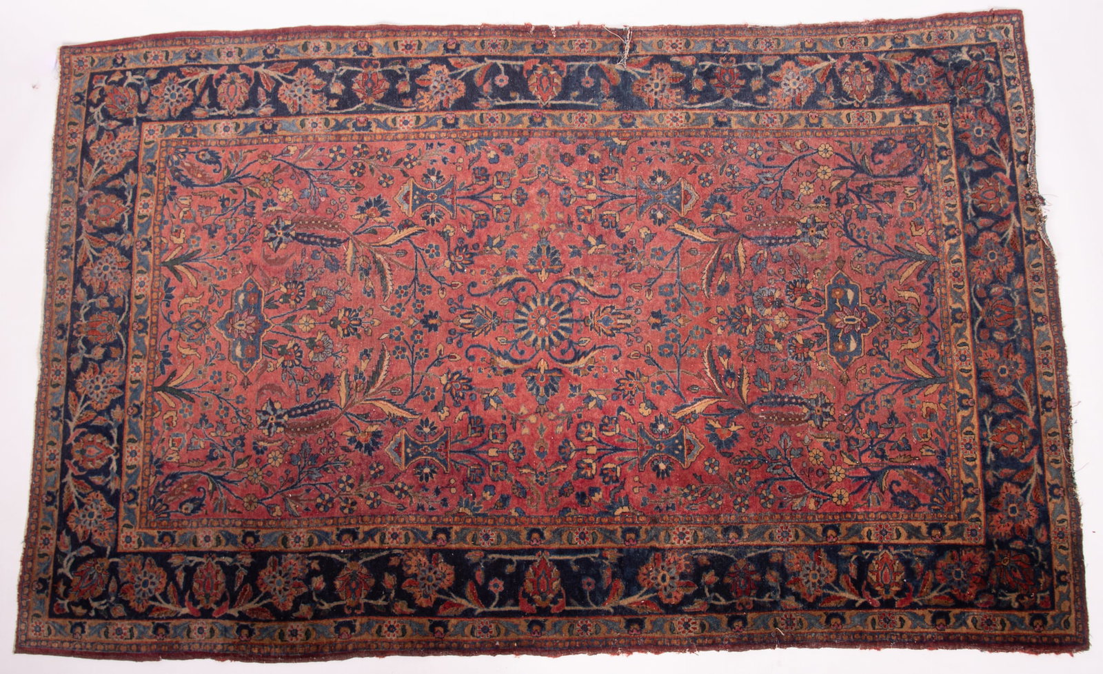 Antique Handwoven Persian Sarouk Area Rug: Antique Handwoven Persian Sarouk Area Rug Wine red floral filled field showing bouquets of flowers amid a navy blue primary border. 4' 2" x 6' 7"