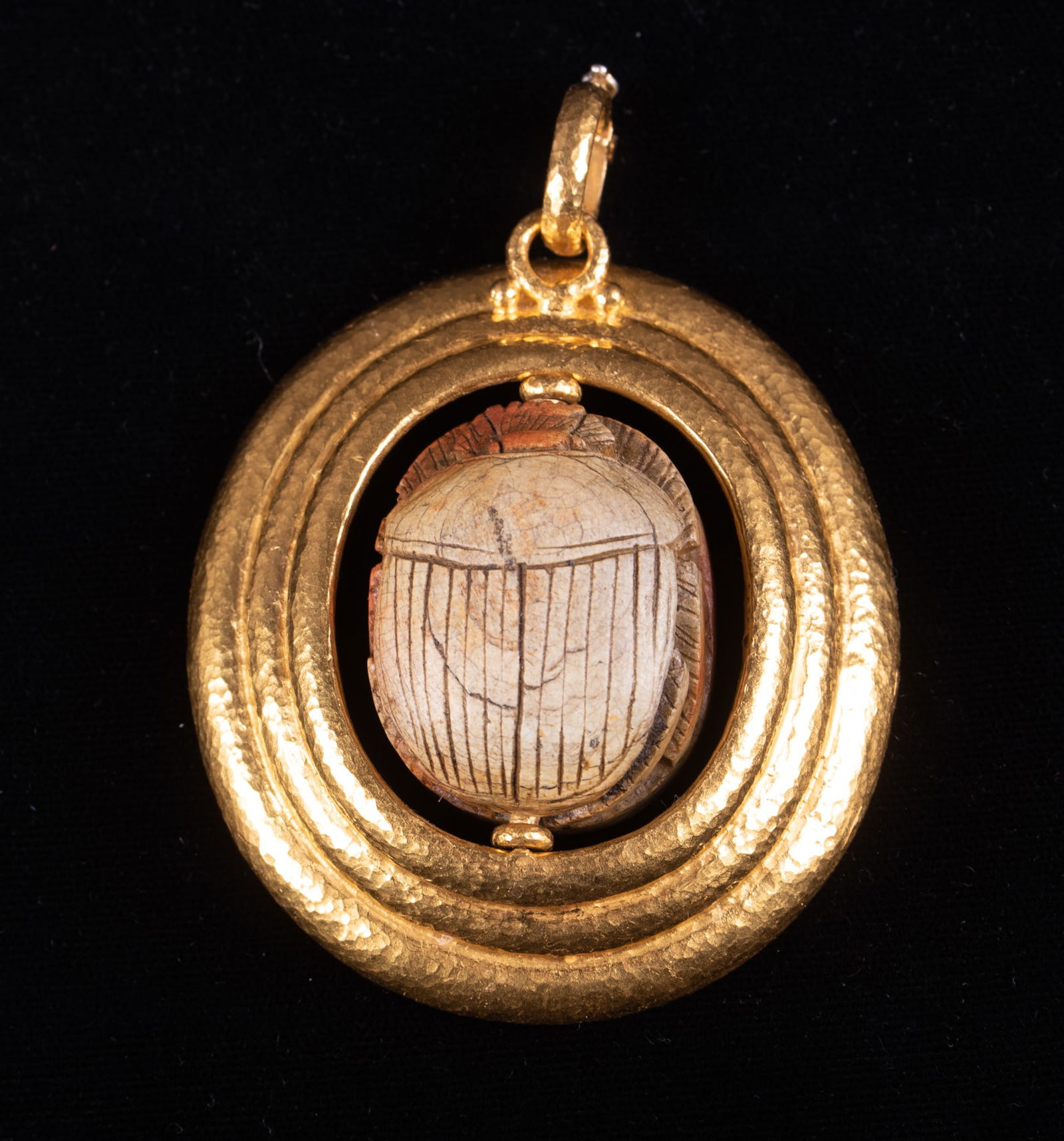 Gurhan Antiquities Scarab Pendant set in 18K Yellow Gold: Gurhan Antiquities Scarab Pendant set in 18K Yellow GoldThe scarab on this fabulous pendant swivels and the back has hieroglyphics carved into it. The piece measures 2 1/4 by 2 inches and weighs 53.7g