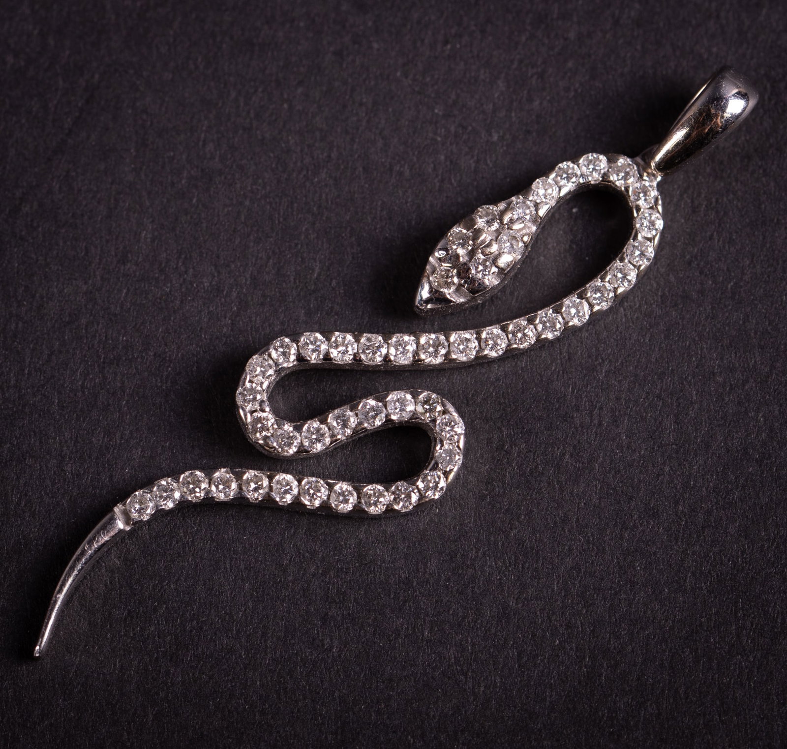 14K White Gold Diamond Snake Pendant: 14K White Gold Diamond Snake Pendant This snake pendant has approximately .50 CTW in diamonds. It measures 1 1/2 inches long and weighs 3g including stones.