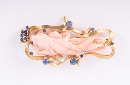 An 18K Gold and Carved Coral Brooch