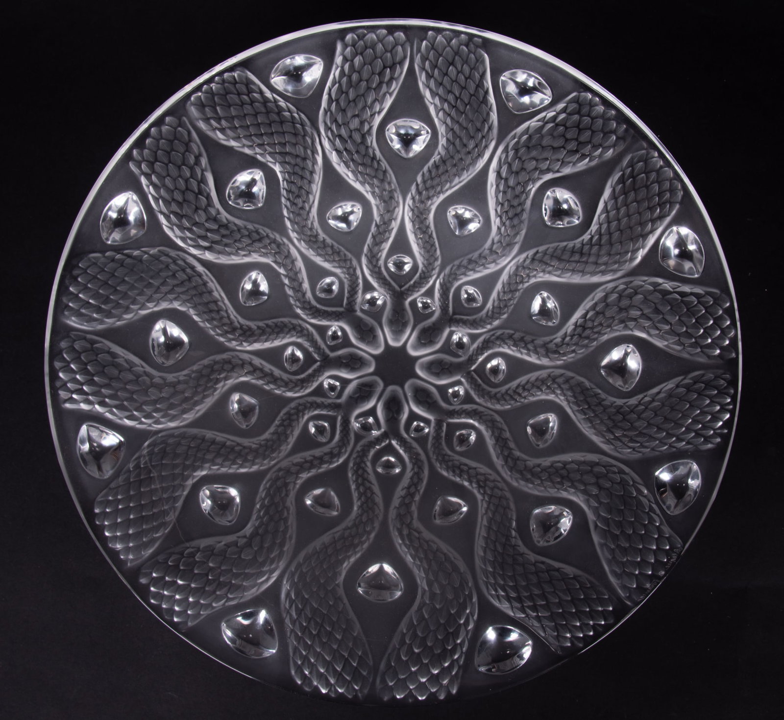 A Large Lalique Frosted Serpent Center Bowl: A Large Lalique Frosted Serpent Center Bowl France, late 20th century, a clear molded and frosted glass bowl with serpents, their heads meeting towards the center, signed Lalique France. 14 7/8 inch d