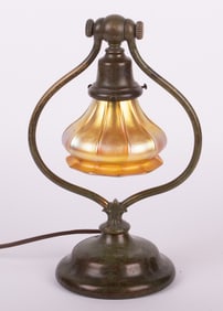 An Art Nouveau Period Bronze Harp Lamp with Quezal Shade