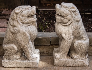 A Pair of Carved Stone Garden Foo Dogs