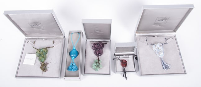 Collection of Four Lalique Serpent Necklaces on Cord and One Lalique Pampille Nerita