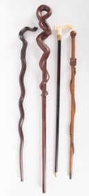Collection Of Four Hand Carved Walking Sticks
