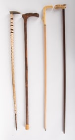 Collection Of Four Hand Carved Walking Sticks