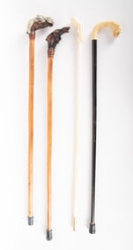 Collection Of Four Hand Carved Walking Sticks