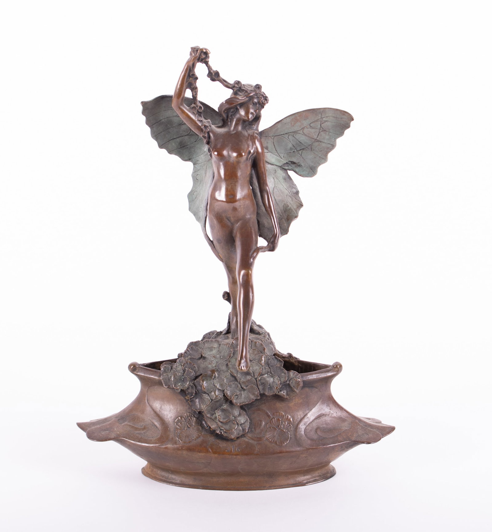 An Art Nouveau Figural Nude Bronze of a Winged Nymph, after Korschann: An Art Nouveau Figural Nude Bronze of a Winged Nymph, after KorschannFemme Papillion, after Charles Korschann (1872-1943), a full figure nude female having outstretched wings perched atop a cascade of