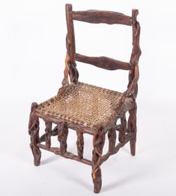 Folk Art Carved Chair with woven stretched animal hide seat