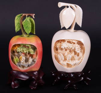 Two Chinese Carved Bone Apples: Two Chinese Carved Bone ApplesChina, mid-20th century, two intricately carved apples with elaborate interior village scenes, one is painted. Both on carved wood stands.Provenance: The Estate of Diana