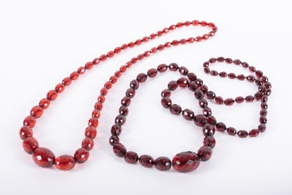 Two Necklaces with Faceted Cherry Amber Colored Beads
