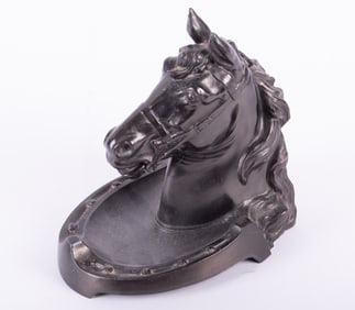 An Antique Patinated Metal Horsehead Inkwell