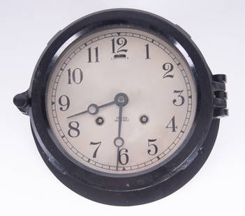 Chelsea Ships Bell Clock in Black Metal Case: Chelsea Ships Bell Clock in Black Metal CaseChelsea 6 inch dial with black metal case and Bakelite bezel door. Serial number 493056.From the collection of Richard Langer.Diameter 7 3/4 inches, Height