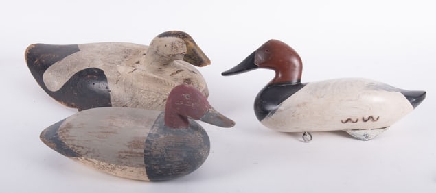 Three hand carved and painted duck decoys