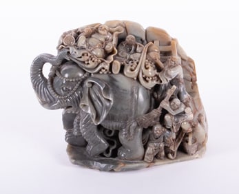 A Chinese Stone Carving of the Buddha on Elephant Back