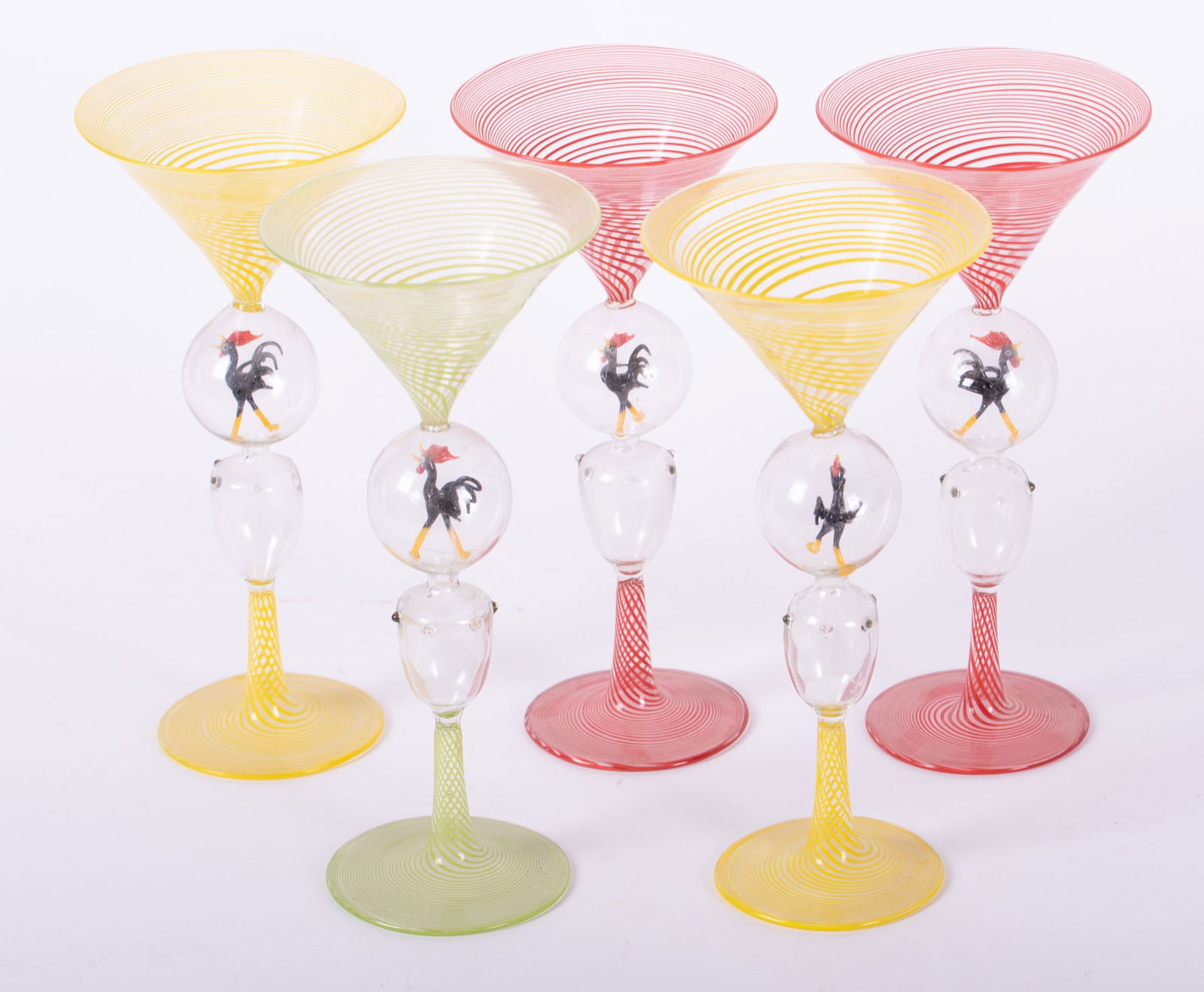 Five Bimini Hand Blown Martini or Liquor Glasses: Five Bimini Hand Blown Martini or Liquor GlassesThe set consists of 2 yellow, 2 red and 1 green twisted base and bowl glasses with clear blown stems having black roosters in the upper ball. Extremely