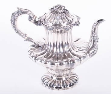 An Antique English Sterling Silver Teapot: An Antique English Sterling Silver TeapotEngland, circa 1829, a fine and well executed teapot by John, Henry and Charles Lias. The unusual squat-form body highlighted with floral form decoration on th