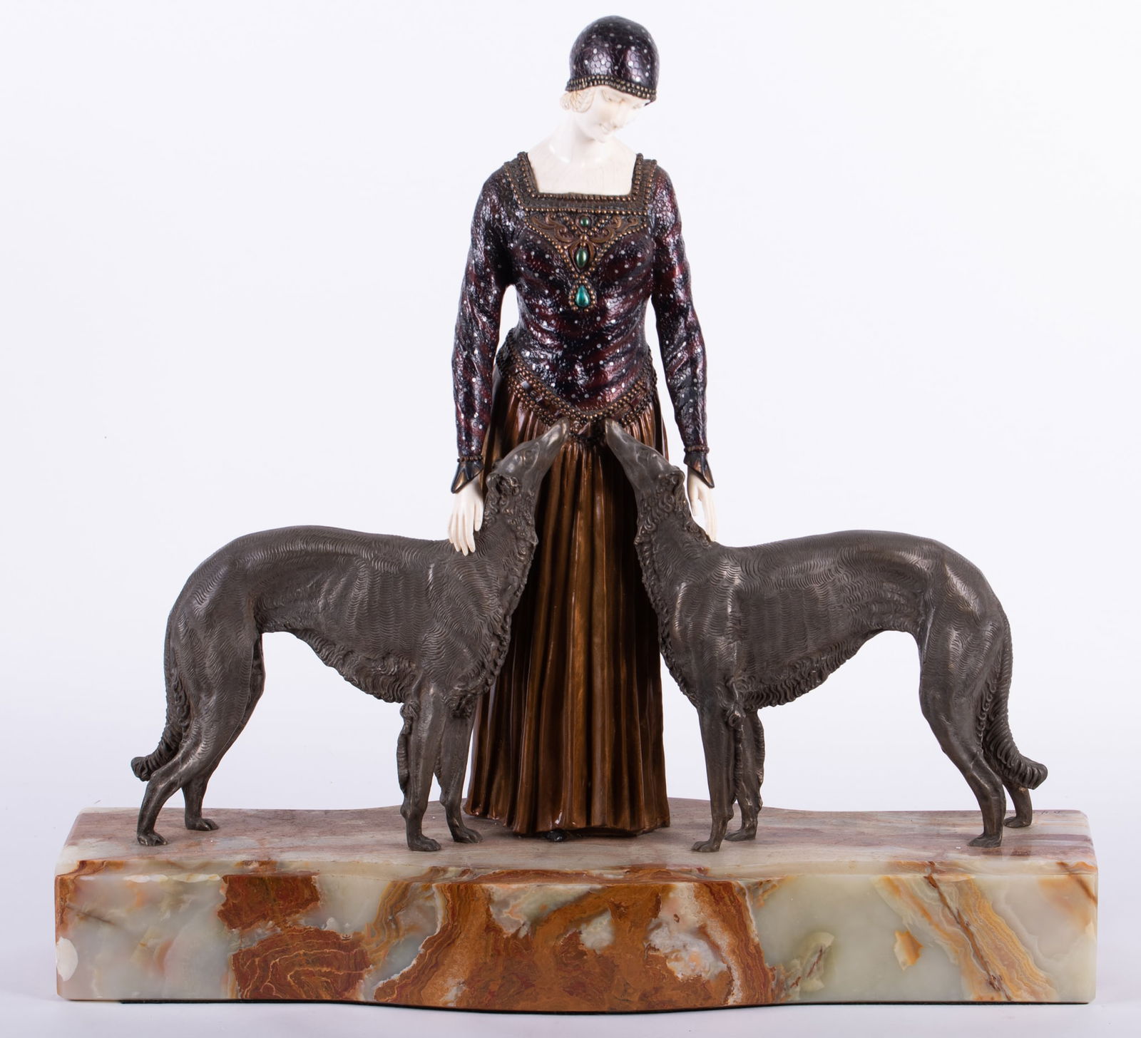 A Monumental Art Deco Style Bronze of a Woman with her Dogs, Les Amis Toujours after Chiparus: A Monumental Art Deco Style Bronze of a Woman with her Dogs, Les Amis Toujours after Chiparusafter Demetre Chiparus (1886-1947), a large size cold-painted bronze and bone sculpture, modelled as an ele