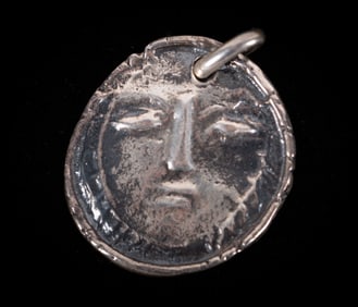 Pablo Picasso, Spanish (1881-1973), Visage, circa 1950, silver pendant