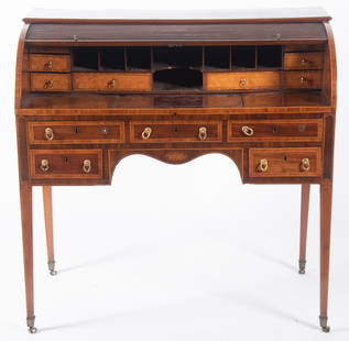 Antique English Edwardian Style Desk: Antique English Edwardian Style DeskCrossbanded top above a cylinder tambour front opening to pigeon holes and central open compartment centering three satin wood crossbanded drawers above an embossed