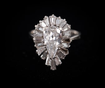 Stunning 1.3 Carat Pear Diamond Ring with Baguette Halo