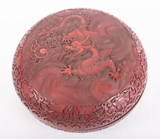 A Large Ornately Carved Dragon Cinnabar Box
