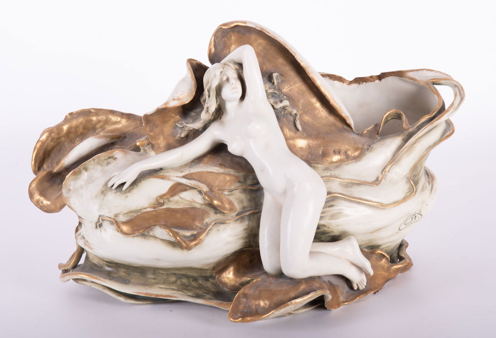 A Large Art Nouveau Amphora Water Lily Vase, Eduard Stellmacher: A Large Art Nouveau Amphora Water Lily Vase, Eduard StellmacherBohemia, late 19th century, a very ambitious vase or jardiniere, the front graced with a female nude against a large lily pad. Bears R. S