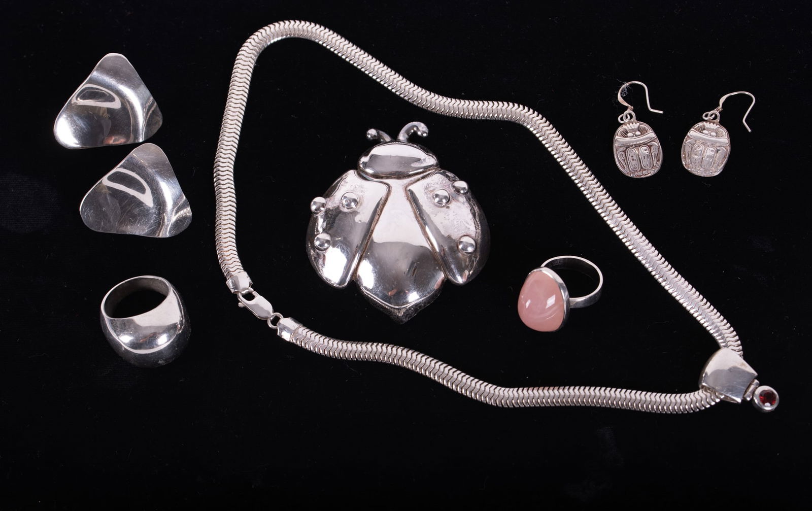 Collection of Sterling Silver Jewelry Comprising: Two Rings, Two Pairs of Earrings, Choker/Necklace