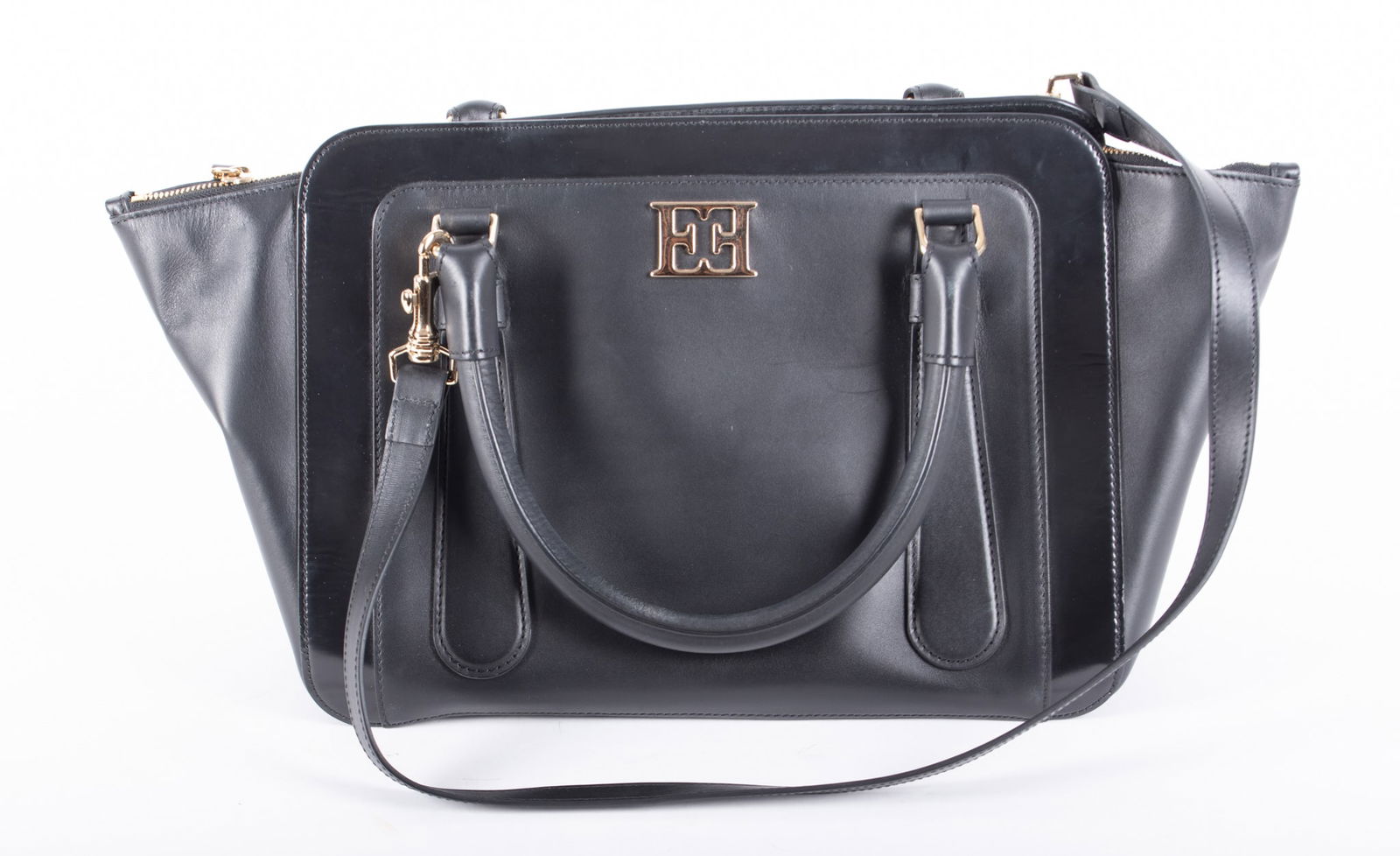 Vintage Escada Handbag: Vintage Escada HandbagThis classic black handbag is in excellent condition. It measures 19" W x 10" H x 7" D. It has a zippered closure with interior pockets, gold hardware and a detachable shoulder s