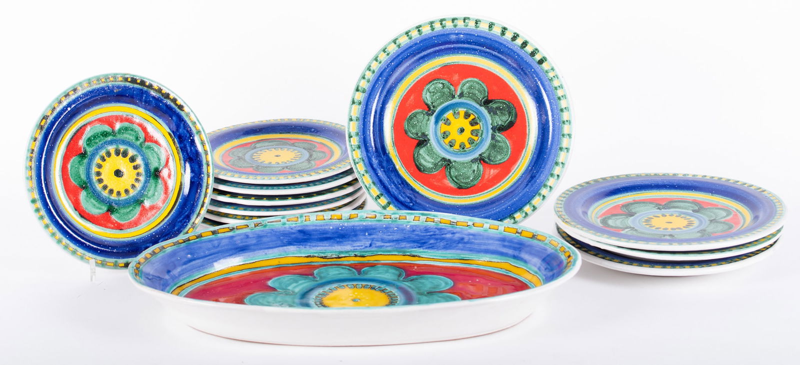 Collection of Desimone Pottery Dining Plates: Collection of Desimone Pottery Dining Plates(5) Five dinner plates 10 inch diameter, (7) seven salad plates 8 1/2 inch diameter, and a large serving tray. All with the flower design and all signed und