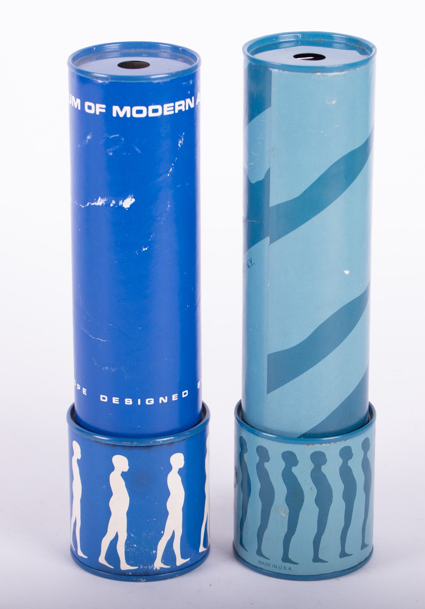 Two Ernest Trova Kaleidoscopes: Two Ernest Trova KaleidoscopesTwo Trovascopes, kaleidoscopes designed by Ernest Trova for the Museum of Modern Art in New York. One of the two is dated 1974. Made of paperboard. There are falling man