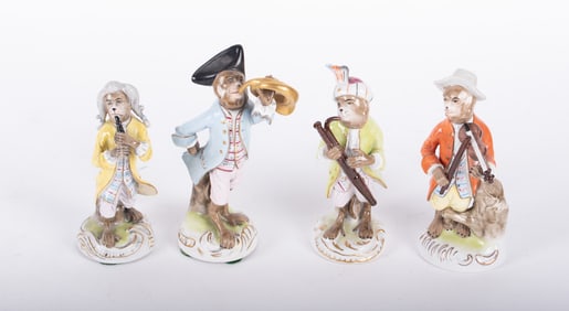 A Set of Four German Scheibe Porcelain Monkey Band Figures