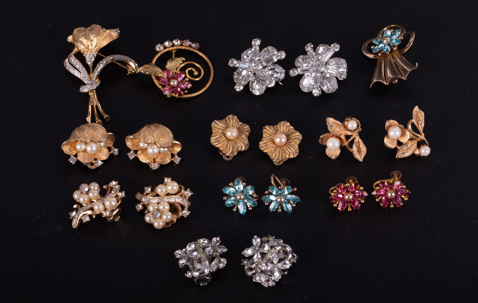 A Collection of Fancy Vintage Floriform Costume Jewelry: A Collection of Fancy Vintage Floriform Costume Jewelryincludes Trifari and 10k gold filled comprising: four pairs of clip-on earrings, three in yellow gold tone with faux pearls, one rhinestone, two