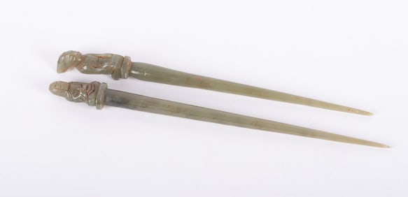 Two Similar Carved Figural Jade Hair Pins