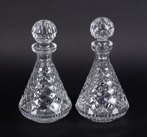 A Pair of Diamond Cut Waterford Decanters