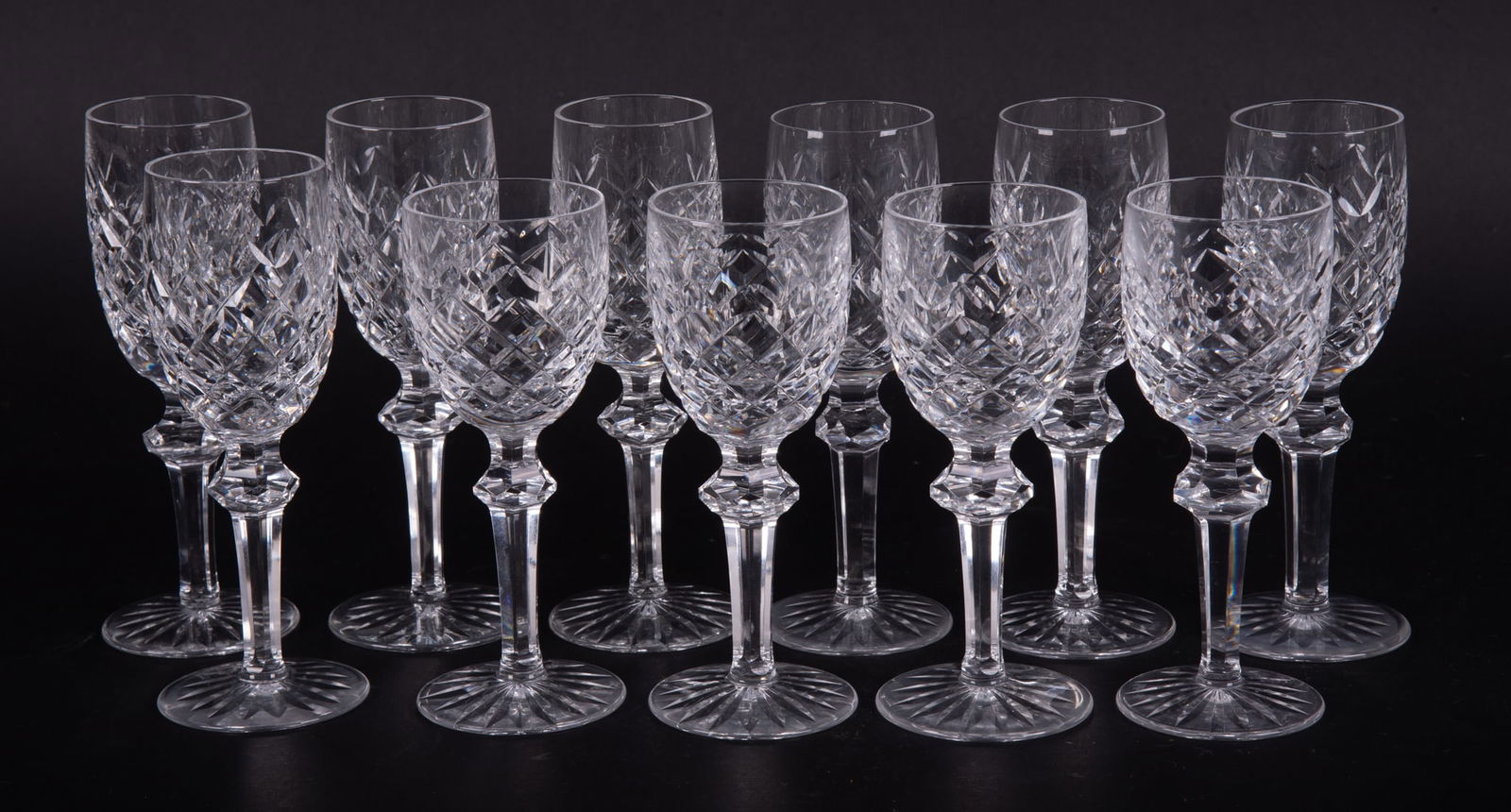 A Set of Eleven Crystal Sherry and Port Wine Goblets, Powerscourt by Waterford: A Set of Eleven Crystal Sherry and Port Wine Goblets, Powerscourt by WaterfordSigned Waterford to the base, the lot includes seven 6 3/8 inch Sherry goblets and four 5 7/8 inch Port Wine goblets, cut