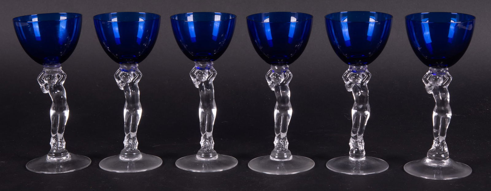 A Set of Six Cambridge Royal Blue Nude Stem Wine Glasses: A Set of Six Cambridge Royal Blue Nude Stem Wine GlassesOhio, Cambridge Glass Company, 6 Art Deco inspired female nude stem glasses in cobalt Royal Blue color from the Cambridge Statuesque collection