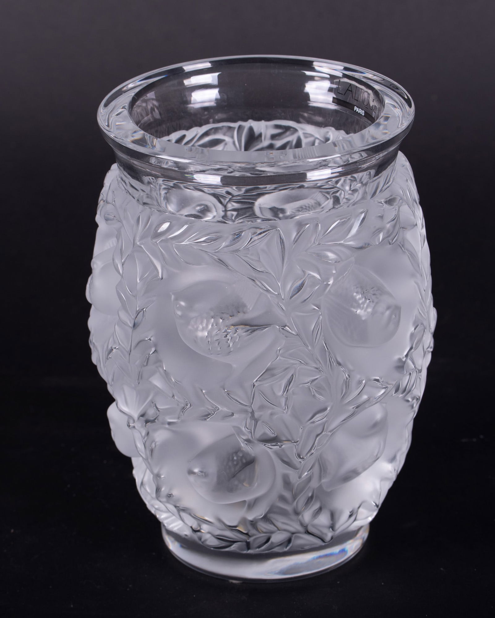 A Lalique Bagatelle Frosted Crystal Vase: A Lalique Bagatelle Frosted Crystal VaseFrance, a heavily embossed frosted crystal vase having multiple sparrows within a deep nest surrounded by vines. Marked Lalique France incised B1086.6 3/4 inche