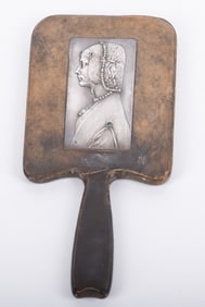 An Austrian Secessionist Silver and Leather Figural Hand Mirror