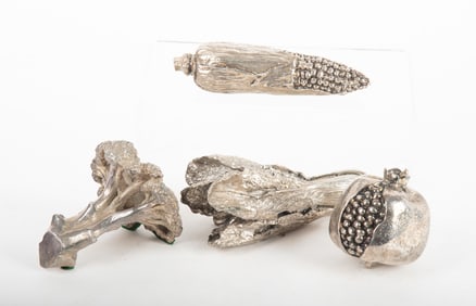 A Collection of Silvered Metal Vegetables and a Fruit