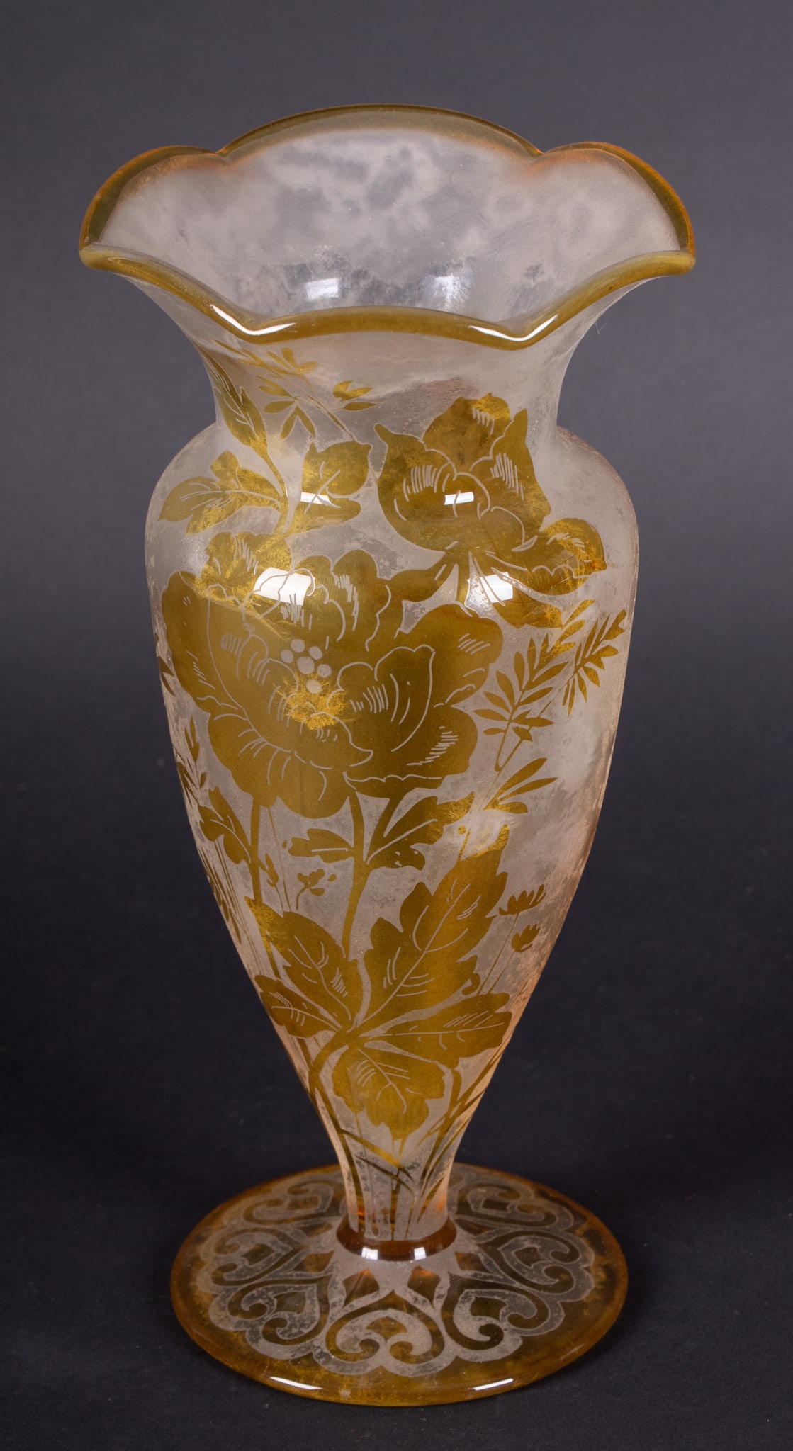 A Handel Etched Amber Cameo Glass Vase: A Handel Etched Amber Cameo Glass VaseAn unusual floral vase with scalloped lip, having cameo and internally etched designs. Marked to Base: Handel 4255.Provenance: The Estate of Diana Eley, St. Louis