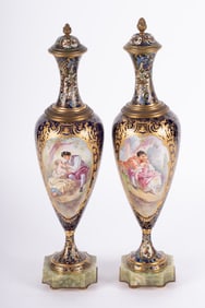 A Pair of French Sevres Porcelain and Champleve Enamel Lidded Vases