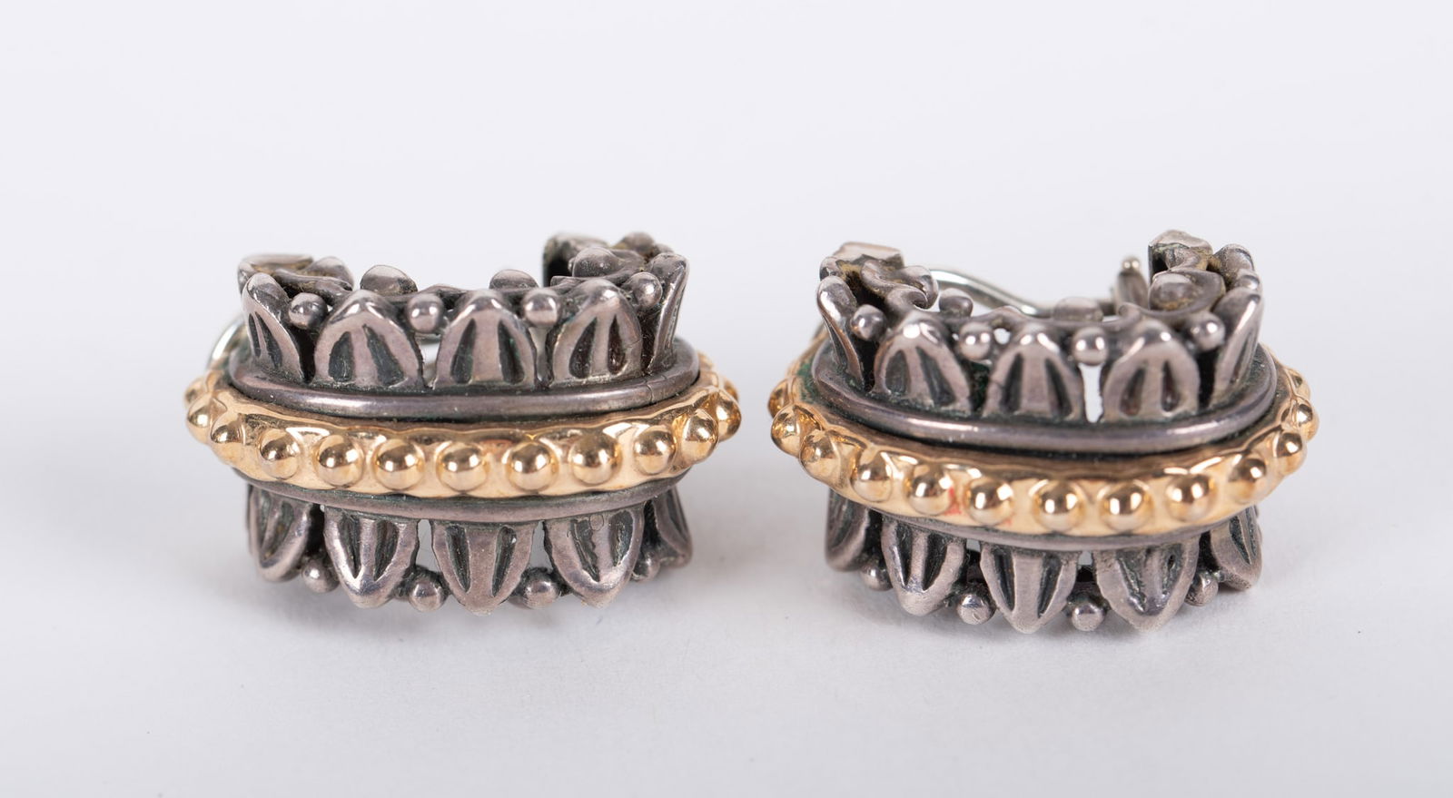 A Vahan 14K/Sterling Earrings: A Vahan 14K/Sterling Earrings This pair for everyday wear, these clip earrings measure 3/4 inches wide by 2 inches around. Gross weight is 18.7g.