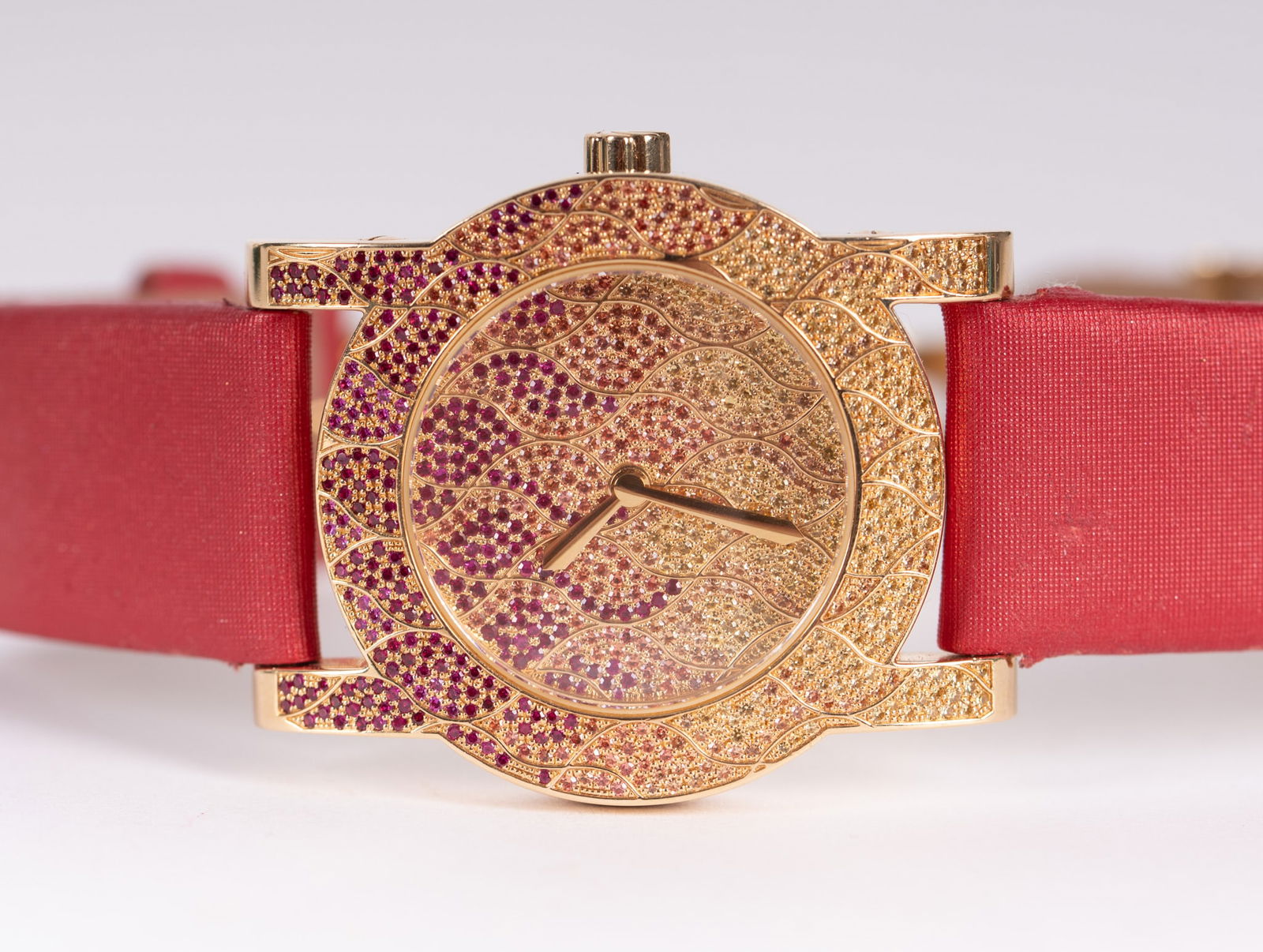 Rare Carl F. Bucherer Pathos Diva 18K Diamond & Sapphire Watch: Rare Carl F. Bucherer Pathos Diva 18K Diamond & Sapphire WatchExtremely rare and collectible, this 18K yellow gold watch is pave' set with pink sapphires and yellow diamonds, elevating it to the level
