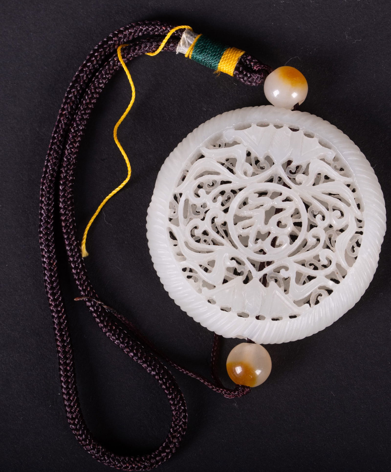 Chinese Carved Jade Double Sided Ornament: Chinese Carved Jade Double Sided Ornament Multilayered ornament is carved on both sides showing different characters. There are four holes on the sides to hang the ornament in any direction. 2 1/8 x