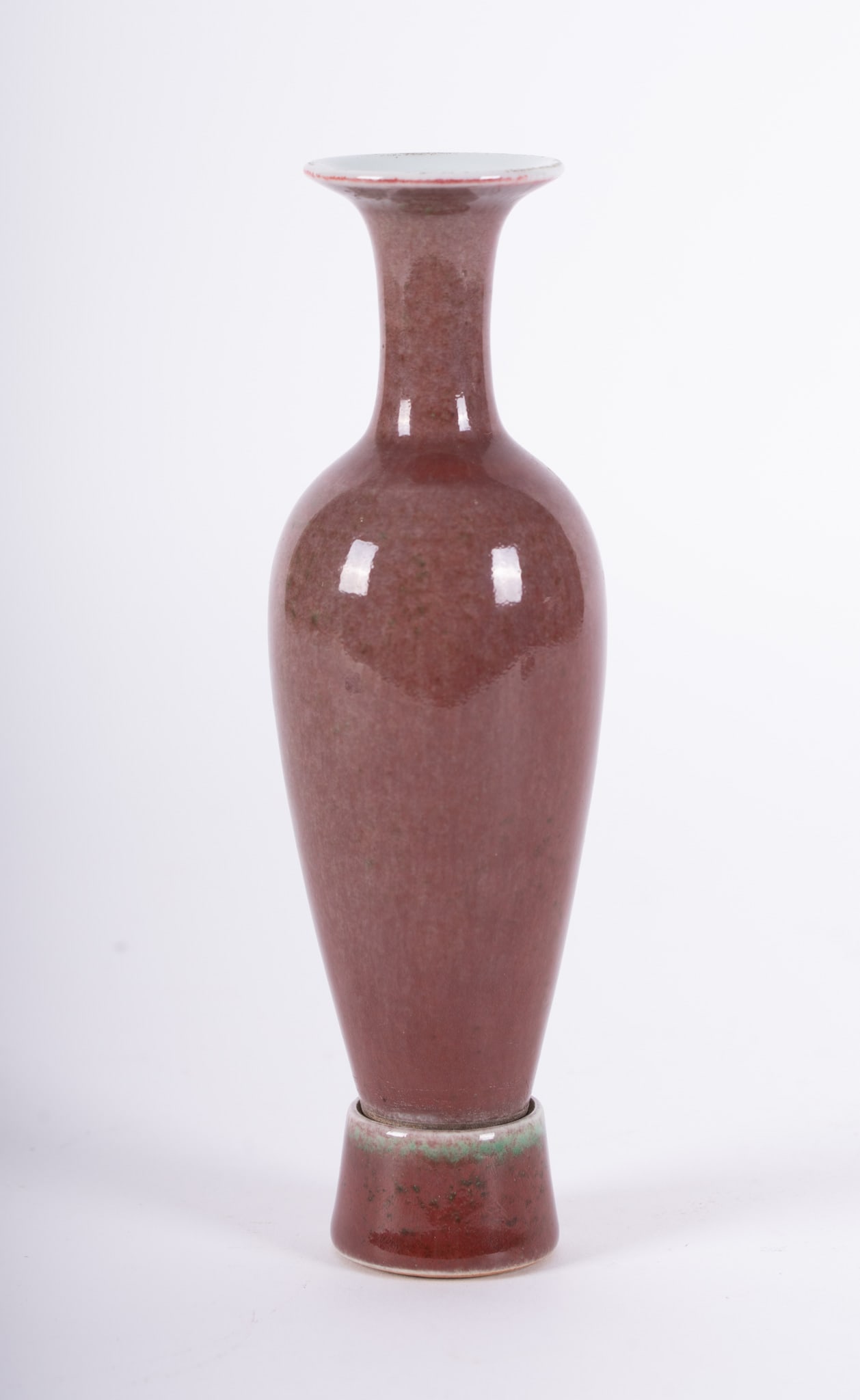 A Chinese Peachbloom Porcelain Vase with Stand: A Chinese Peachbloom Porcelain Vase with StandSlender vase with a matching stand. The underside bearing a six-character mark.7 inches height, approx 2 inches diameter