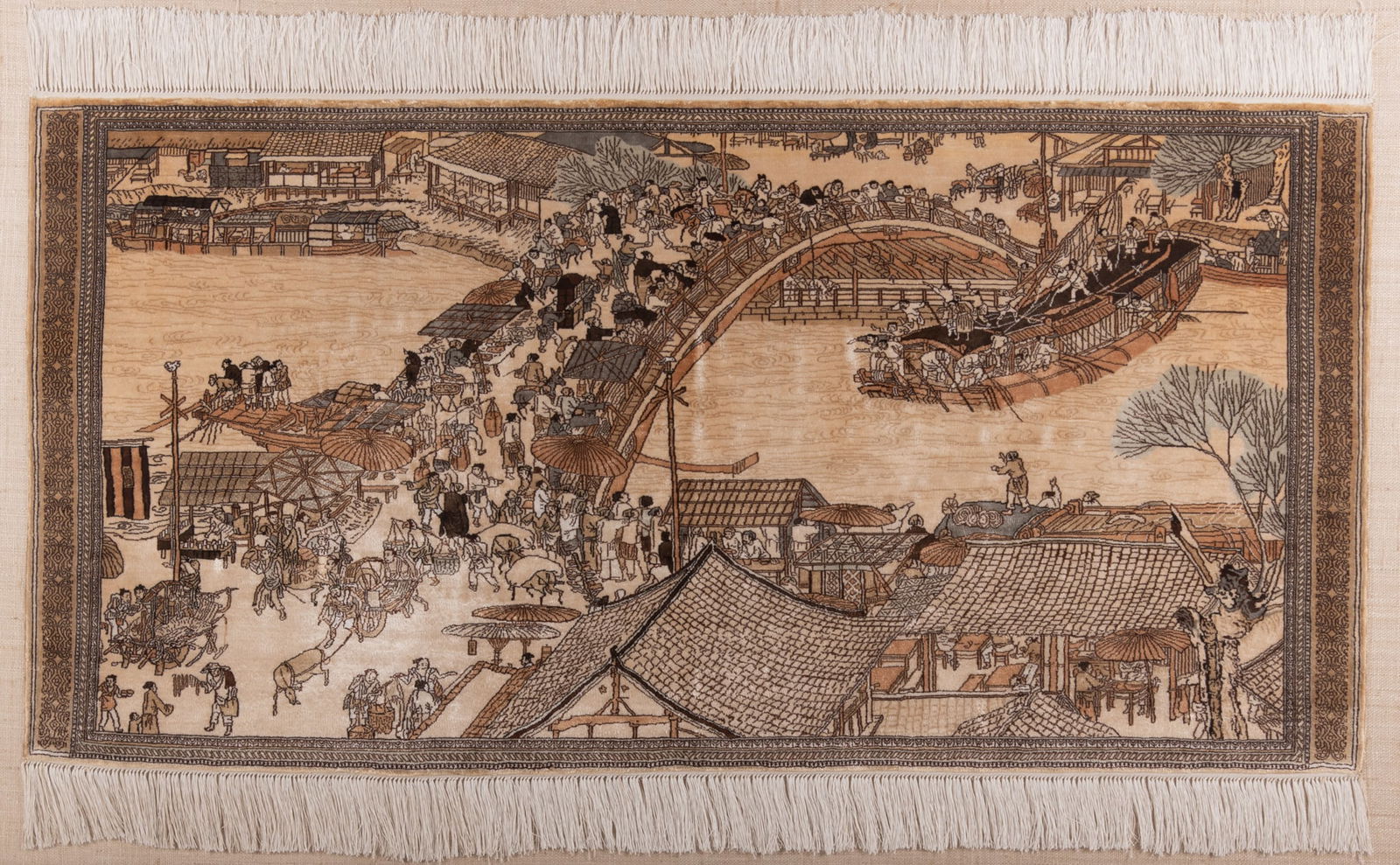 Intricately Handwoven Framed Silk Tapestry: Intricately Handwoven Framed Silk Tapestry Showing an Asian landscape depicting "Along The River During The Quingming Festival". It depicts a Song Dynasty boat with multiple figures centering a