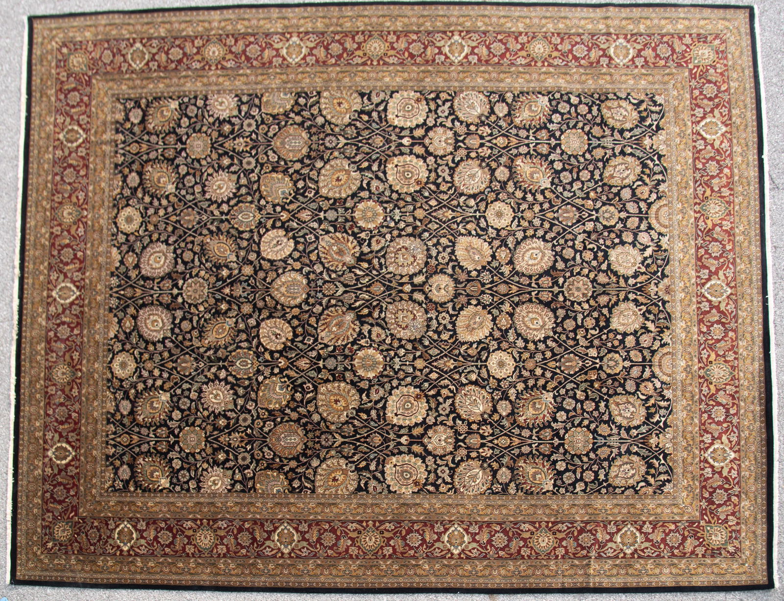Handwoven Indian Oushak Design Room Rug: Handwoven Indian Oushak Design Room Rug Dark blue field filled with assorted floral motifs amid a red foliate primary border and guard borders. 11' 9" x 14' 10"