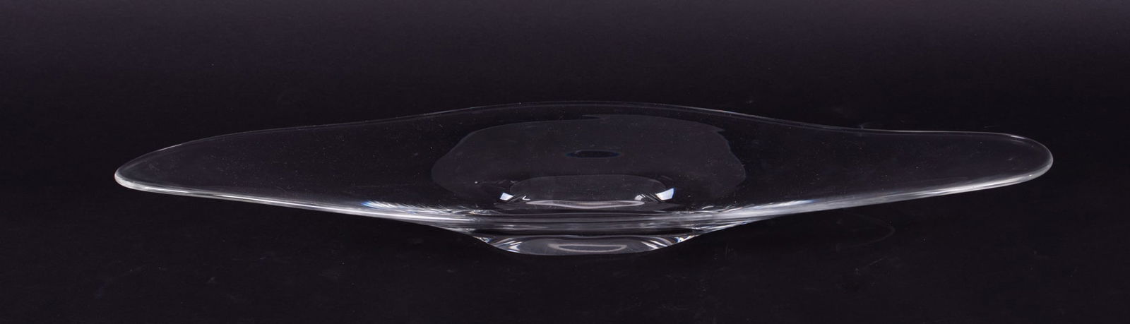 A Steuben Mid-Century Design Elongated Center Bowl: A Steuben Mid-Century Design Elongated Center BowlCorning NY, a late 20th century low bowl or long tray having an asymmetric shape. Script Steuben signature to base.24 inches long, 8 1/4 inches wide,